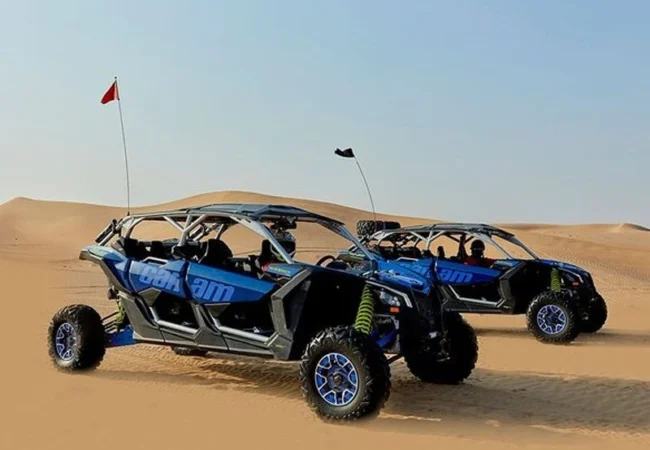 Can-Am X3 RS Turbo RR four-seater buggy parked on a Dubai dune crest